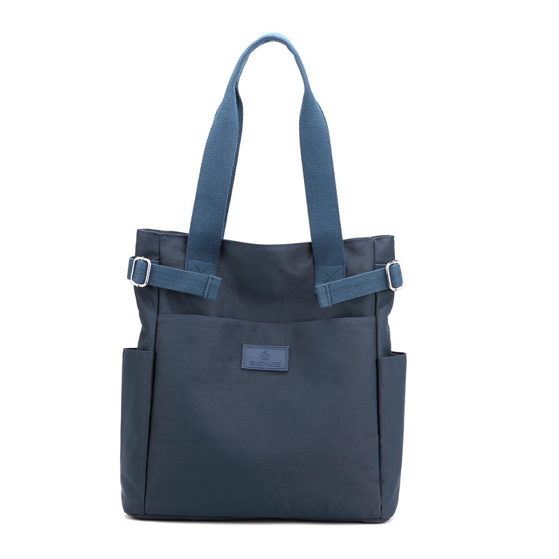 Large capacity multi-compartment canvas handbag